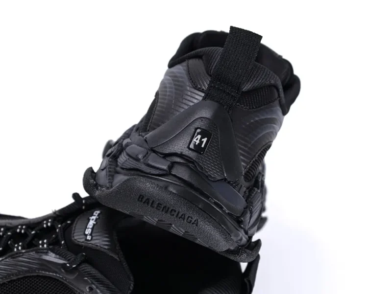 Black sneaker heel with durable material and visible branding and size label.