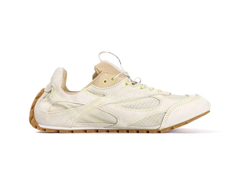 Cream and beige sneaker with suede and mesh details, featuring rubber sole.
