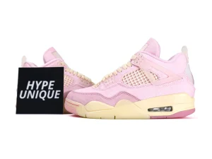 Pink fabric sneakers with textured mesh panels and cream rubber soles.