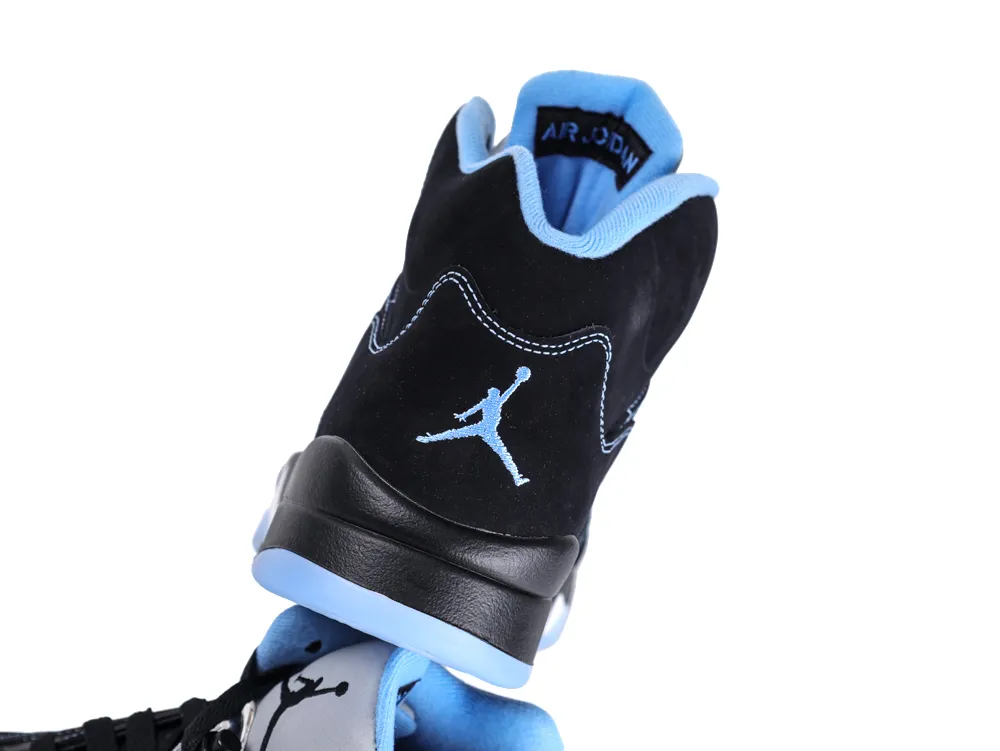 Black suede sneaker heel with light blue accents and logo embroidery.