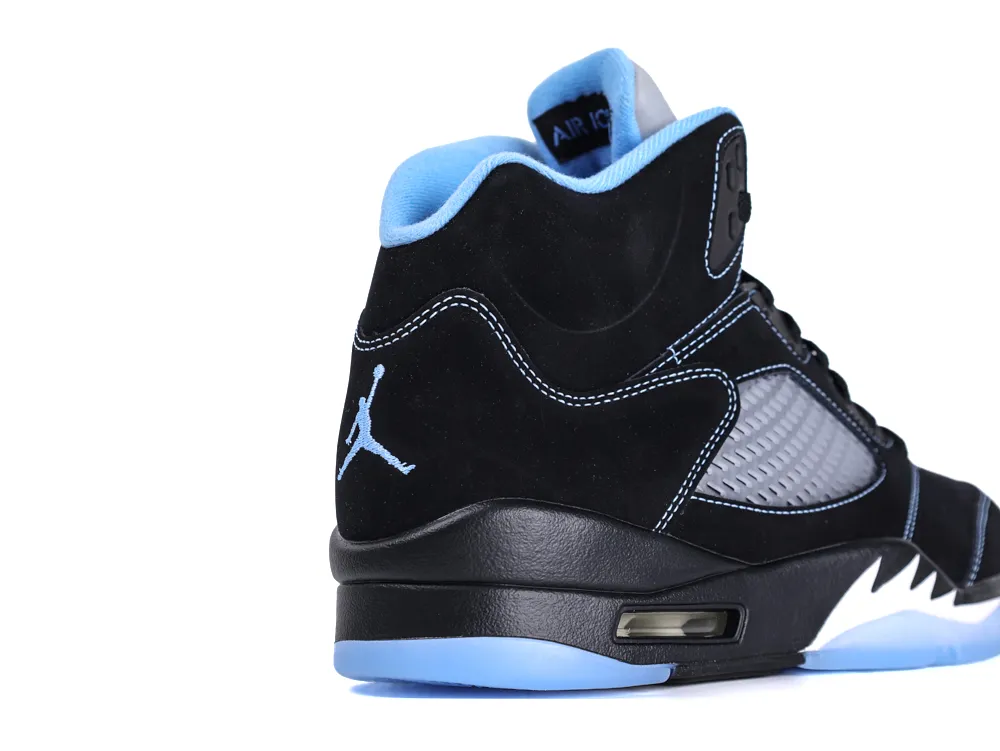 Black suede sneaker with blue accents and mesh detailing on the heel.
