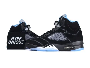 Black and blue suede sneakers with mesh side panels and translucent soles.