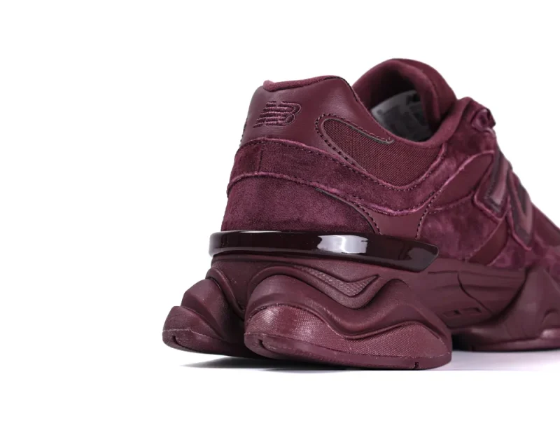 Burgundy sneaker with suede material showing the rear and outsole design.