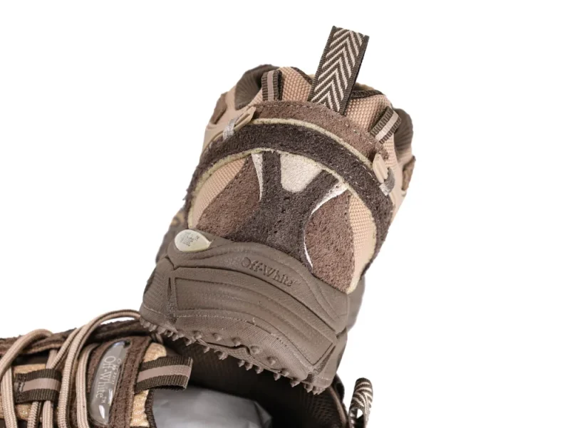 Brown and beige suede and fabric sneaker with herringbone-patterned pull tab.