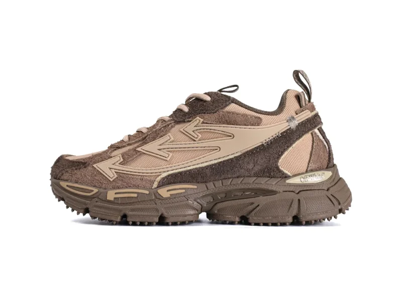 Brown and beige sneaker with suede and mesh materials, featuring detailed stitching and textured sole.