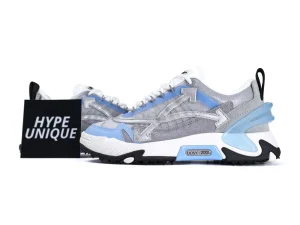 Gray and blue suede sneakers with white sole and black and blue accents.