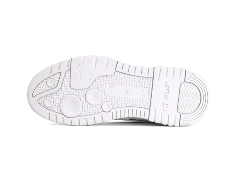 White rubber shoe sole with textured tread patterns and branding details.