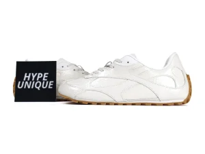 Lateral view of the cream leather Orbit Flash sneakers highlighting the glossy, textured finish
