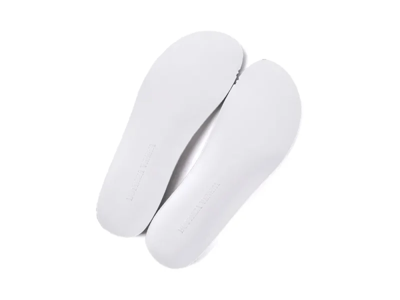 Pair of white leather insoles with the Bottega Veneta brand name embossed at the heel.