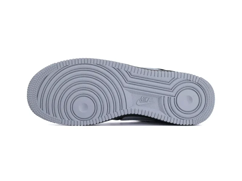 Full view of the Smoke Grey rubber outsole with the classic Air Force 1 circular traction pattern.