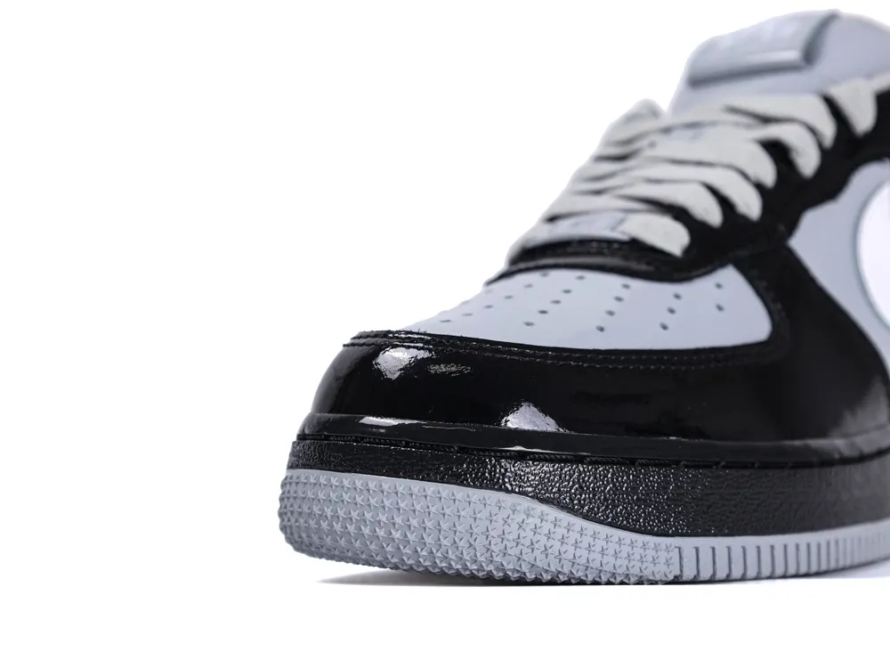 Close-up of the glossy black patent leather toe box and grey outsole on the Central Cee Air Force 1.