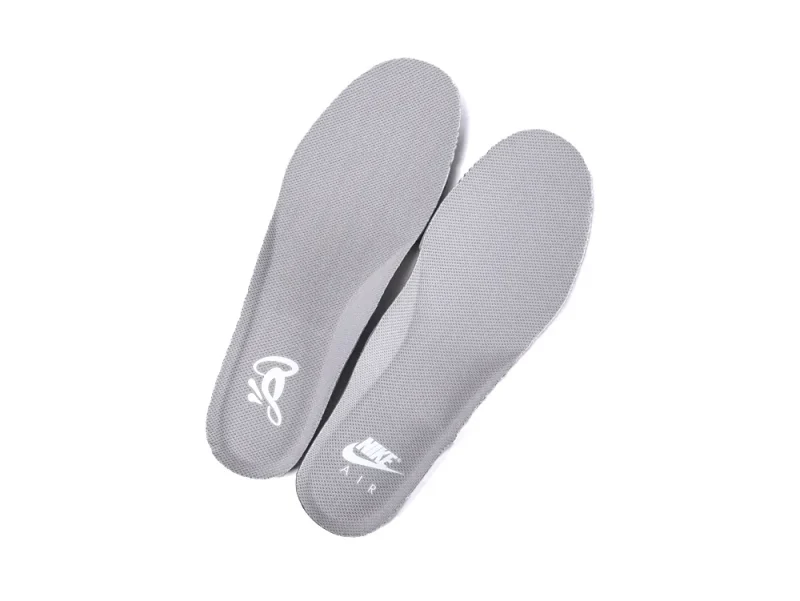 Pair of grey insoles with the Nike Air logo and the Syna World "C" embroidered logo.
