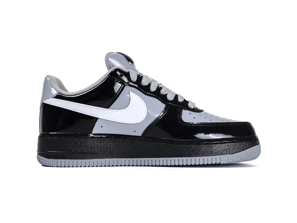 Medial side view of the right Nike Air Force 1 Low x Central Cee in black and smoke grey.