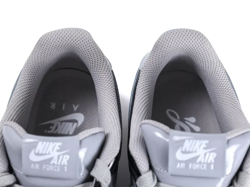 Top-down view showing the padded grey mesh lining and the dual-branded insoles of the sneakers.