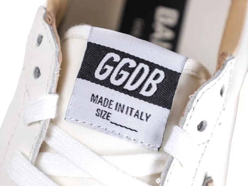 Close-up of GGDB Made in Italy logo patch on sneaker tongue