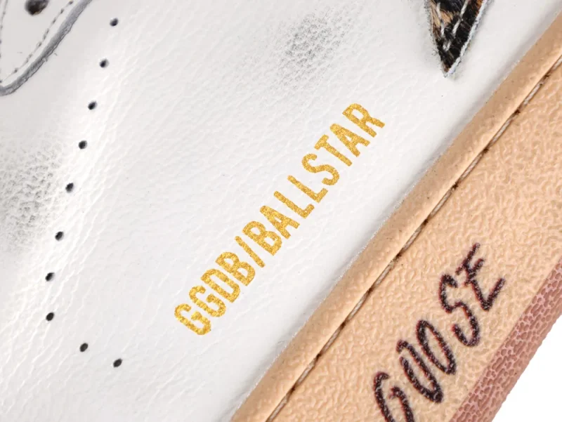 Gold GGDB/BALLSTAR logo detail on white leather sneaker