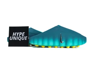 Pair of Nike Mind 001 Geode Teal sneakers with branding card