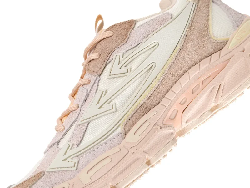 Detailed view of the multi-layered suede panels and the oversized Off-White arrow logo on the side.