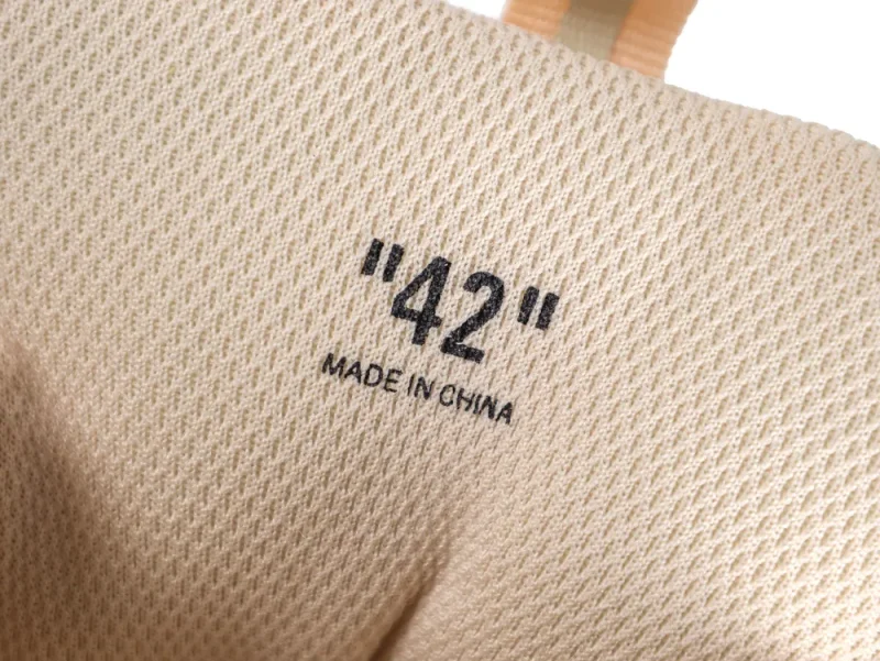Interior view of the mesh lining showing the "42" size print and "Made in China" text.