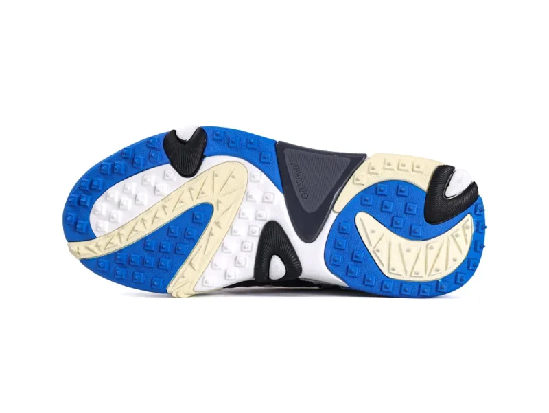Blue, white, and beige rubber sneaker sole with textured patterns and grooves.