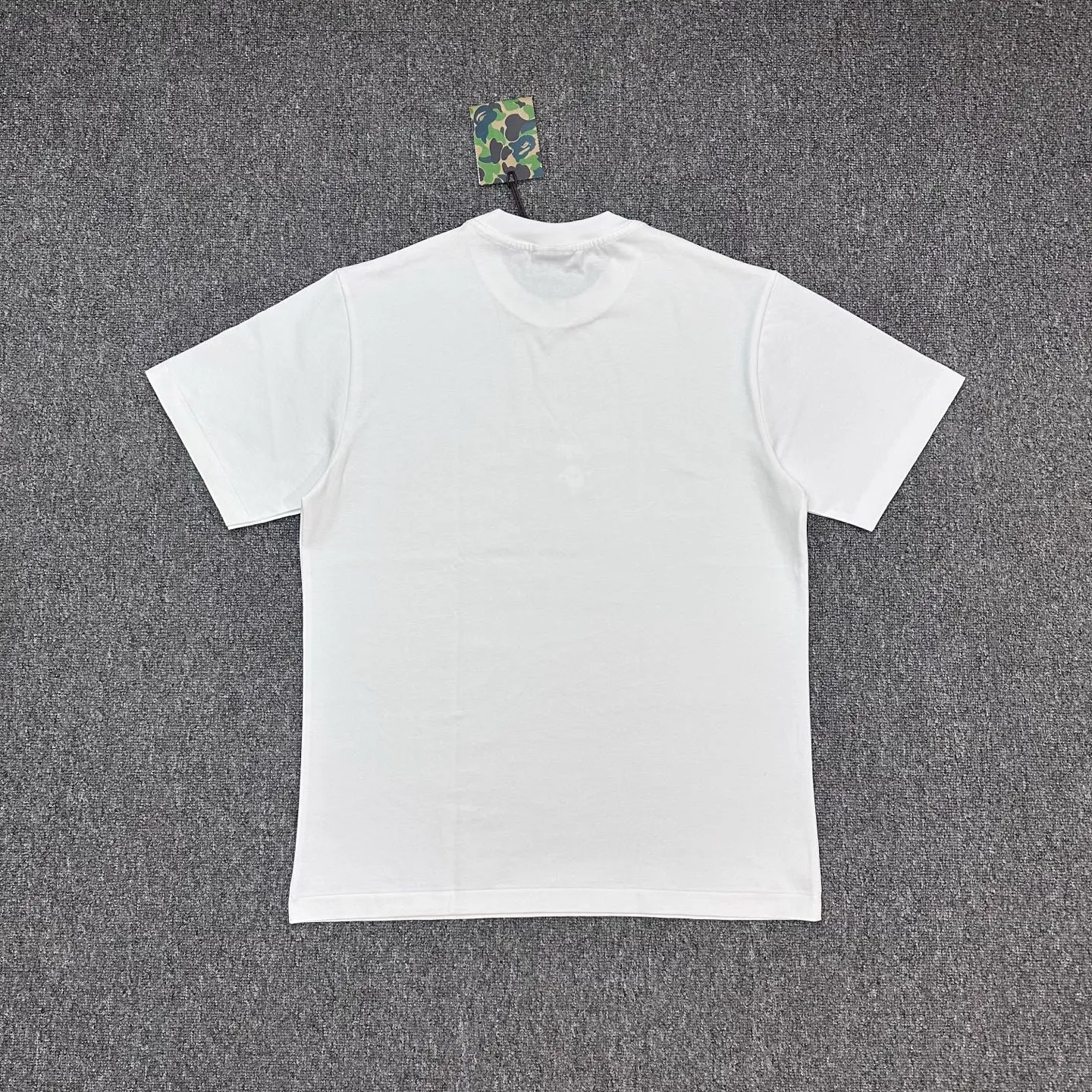 Back BAPE × EVOLUTION Nicholas Tse Ape Head Graphic T-Shirt