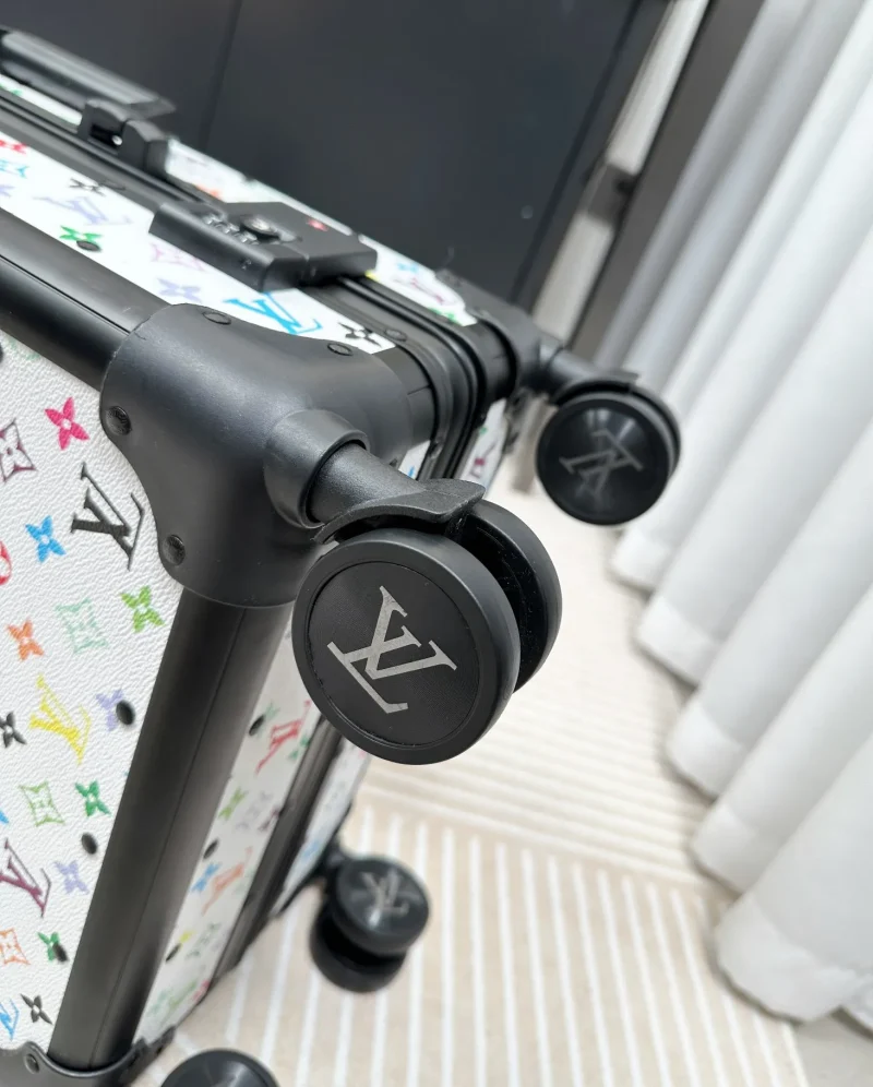 Multicolor monogram luggage spinner wheel detail