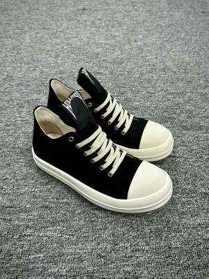 R 0wens DRKSHDW Hollywood Slip-On Low BlackMilk Sneakers Angeled View